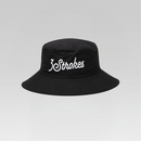 A black bucket hat with '3Strokes' embroidered in white script across the front, set against a neutral gray gradient background.