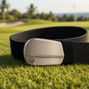 Black belt with silver buckle on a golf course